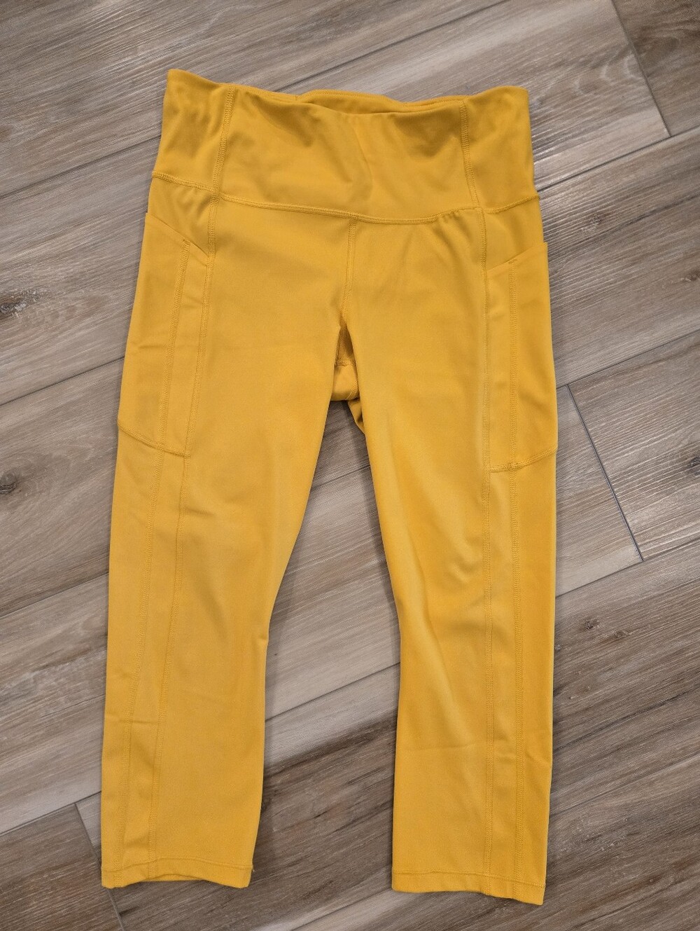Athleta Ultimate Stash II Capri Leggings in Mustard Yellow